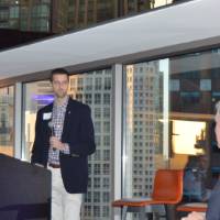 An alumnus presents T.Haas at the Chicago Alumni Reception